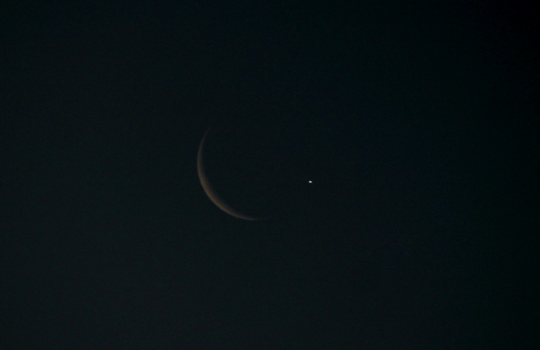 Crescent Moon occults Venus in the morning sky